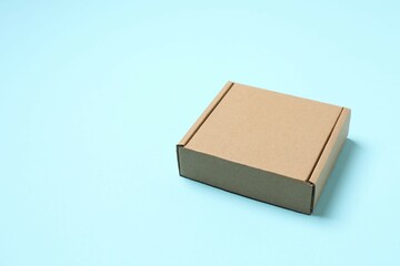 Сardboard box on color background