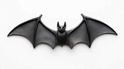 Naklejka premium spooky black rubber bat isolated on a clean white background embodying the essence of halloween and playful fright perfect for seasonal festivities and themes