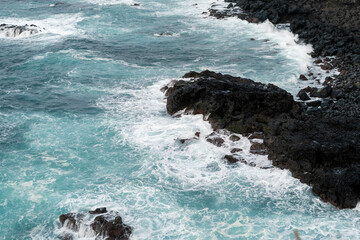 waves crashing on rocks