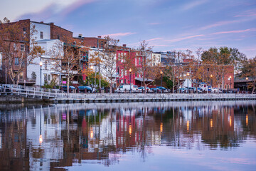 Cityscape of Seneca Falls, New York along the Cayuga and Seneca Canal at dusk.