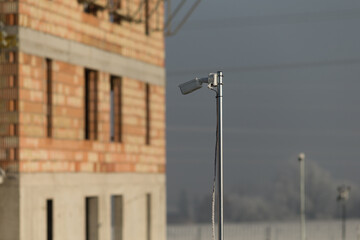 Construction Site on a Sunny Frosty Winter Day. Blend of nature and industry. Construction site bathed in bright sunlight on a frosty winter day.