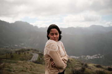 Naklejka premium Girl Enjoying the Countryside in a White Sweater on a Chilly Day