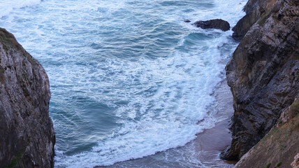 waves crashing on rocks
