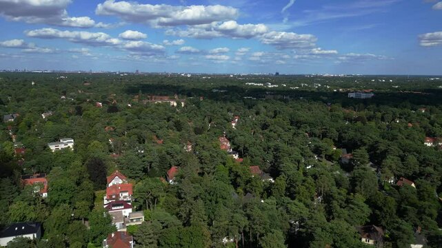 residential district green forest cloudy sky. Majestic aerial view flight drone
