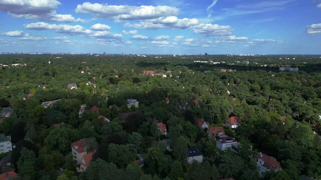 residential district green forest cloudy sky. Amazing aerial view flight drone