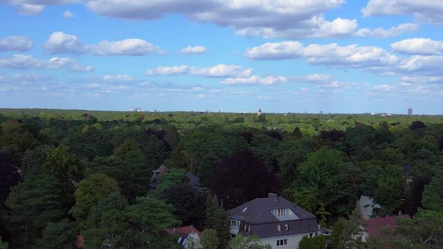 residential district green forest cloudy sky. Smooth aerial view flight drone