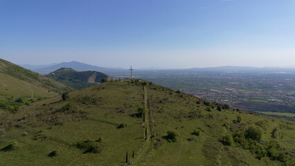 Aerial view of the medieval town of Casertavecchia with the castle and the Christian cross on the top of the nearby hil