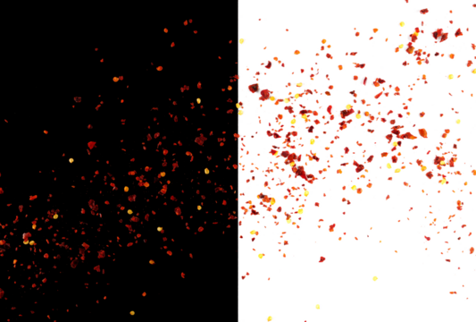 Spicy chili red pepper flakes flying, chopped, milled dry paprika pile isolated on white	and black