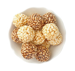 Tasty puffed rice balls in bowl isolated on white, top view