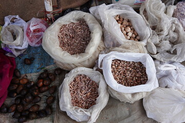 Whole and slices areca nuts displayed in the store
