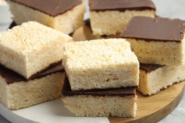Delicious puffed rice bars on table, closeup