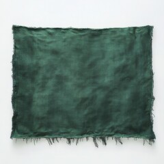 A rectangular piece of raw denim fabric, dyed a deep green color, displayed against a plain background. The edges of the fabric are frayed
