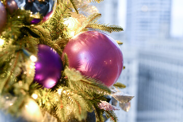 Christmas tree ornaments hanging on the branches