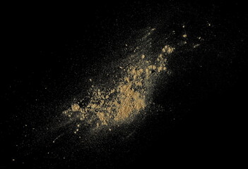 Yellow maca organic powder, isolated on black, top view