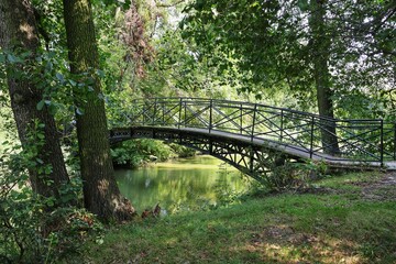 Fototapeta premium A pedestrian bridge in a park in Pszczyna, Poland.