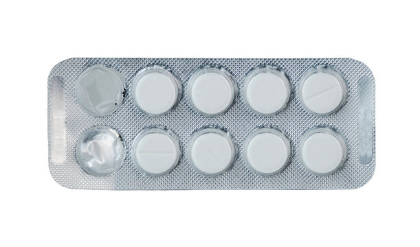 White round pills in blister pack laid on a flat surface - Powered by Adobe