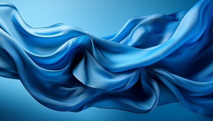 Obraz premium blue fabric flowing in the wind creating abstract shapes on a blue background