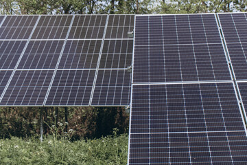 Solar panels providing sustainable energy in a green field