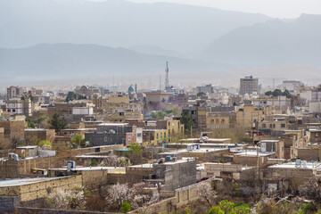 Fototapeta premium Panorama of Kashan, Iran, as seen from Tepe Sialk Hill. Background: Karkas Mountains