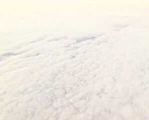 Full frame of white cloud formation from plane window above