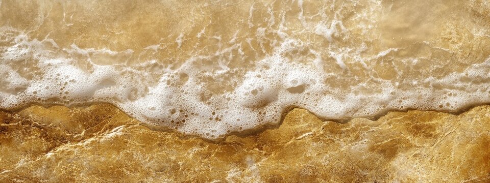 Captivating marine textures showcasing reflective wet sand and smooth surfaces meeting dry granular sand along the serene shoreline