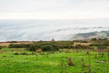 Temperature Inversion with clouds hugging valleys and hills.