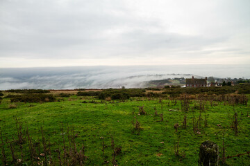 Temperature Inversion with clouds hugging valleys and hills.