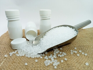 polymer, virgin polymer resin granules type grade homopolymer, isolated virgin polymer resin pellets with white background, suitable for product catalog design of plastic industry company profile