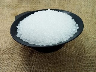 polymer, virgin polymer resin granules type grade homopolymer, isolated virgin polymer resin pellets with white background, suitable for product catalog design of plastic industry company profile
