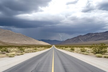 Naklejka premium Lightning illuminating the sky above a long, straight road stretching into the vastness of death valley national park, capturing the dramatic beauty and power of nature