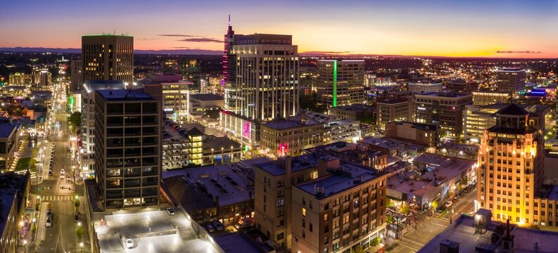 City skyline at twilight. Urban landscape with illuminated buildings and streets. Evening view of downtown. Downtown, Boise, Idaho, USA.