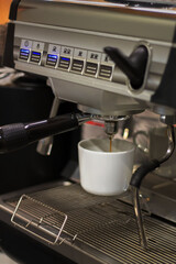 Crafting espresso in a modern coffee shop during early morning hours