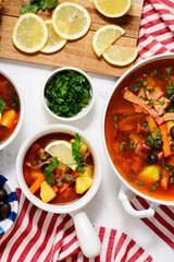 Solyanka. Russian traditional soup with smoked meats and pickles .style rustic