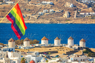 Iconic picture of Mykonos. Famous windmills of Mykonos Island, Greece with Rainbow flag LGBT...