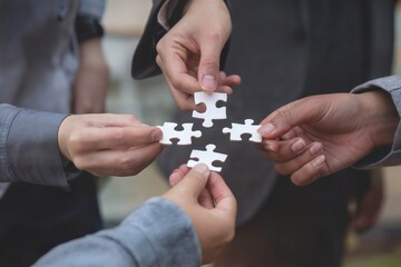 Hands and business teamwork connecting puzzle pieces for strategy and success