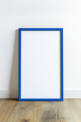 Vibrant blue mockup poster frame on the wooden floor by the wall