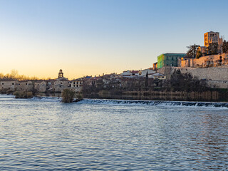 Fototapeta premium Photography of the Zamora cathedral, the Olivares mills and the Duero river. Evening light. Zamora. Castilla y León. Spain