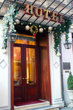 Bucharest, Romania &ndash; January 1, 2025: Entrance of Casa Capsa old renowned hotel on Calea Victoriei boulevard in center of Bucharest, decorated for Christmas