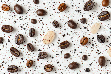 Obraz premium Coffee beans and a cup of coffee on a white surface.