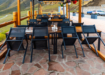 an open-air restaurant in the mountains in the early morning before opening day