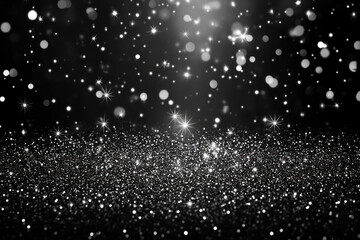 Obraz premium Black and white glitter background with shimmering sparkles against a dark backdrop.