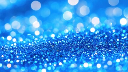 Sparkling blue glitter forms a radiant abstract design, capturing light and enhancing creativity in artistic and festive endeavors