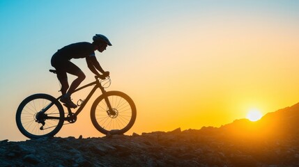 Fototapeta premium A cyclist rides uphill against a stunning sunrise, silhouetted against colorful skies, evoking a sense of adventure and freedom