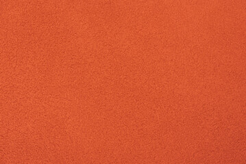Fototapeta premium Orange suede as a background. Suede leather macro photo.