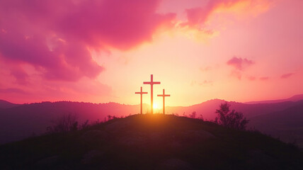 Obraz premium A dramatic image of three crosses silhouetted against a vivid orange and pink sunset on a hill, symbolizing the crucifixion. The surrounding landscape is serene, emphasizing the solemnity of the momen