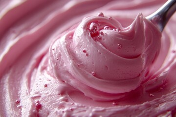 Close-up of a pink whipped cream swirl with creamy texture