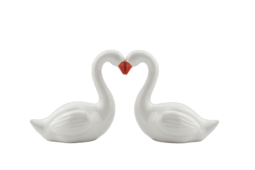 Valentine Day: Valentine Day concept: A pair of swan figurines forming a heart shape with their necks isolated on white background.
