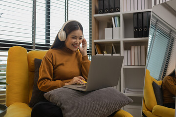 Naklejka premium happy and comfortable at home in the morning, young woman relaxing at home, girl resting in her room, enjoy life, rest, relaxation, wellbeing, lifestyle,