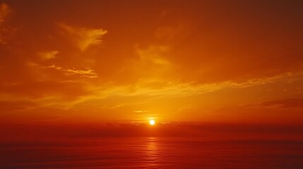 Obraz premium Fiery sunset over calm ocean.