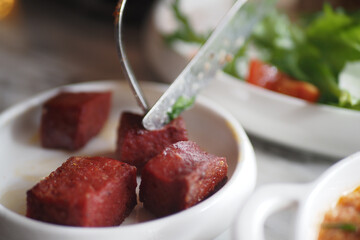 Tasty and Delicious Cubes of Cooked Meat Served with Fresh Salad Garnish